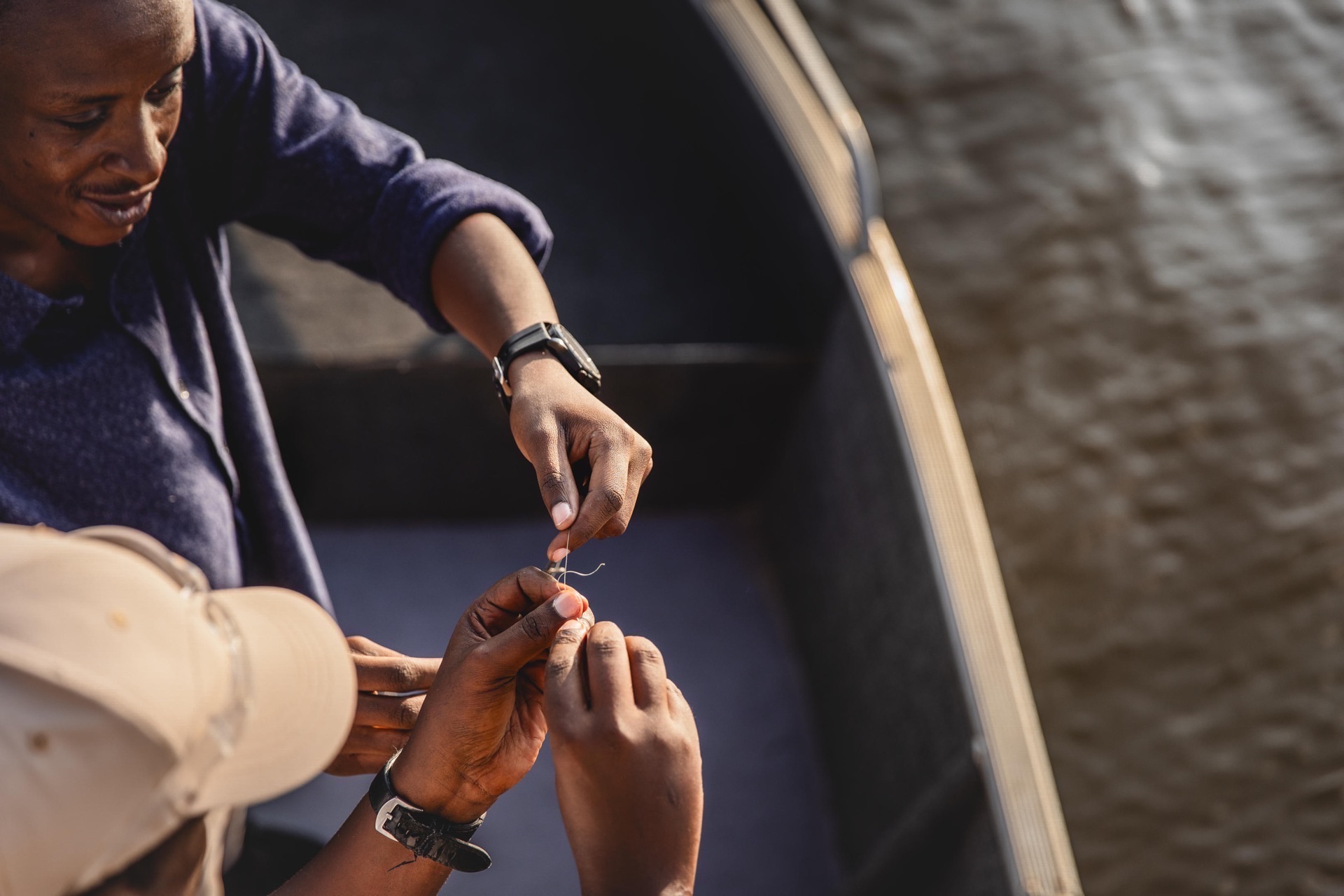 Local guide at work on a boat at Akagera National Park, Rwanda