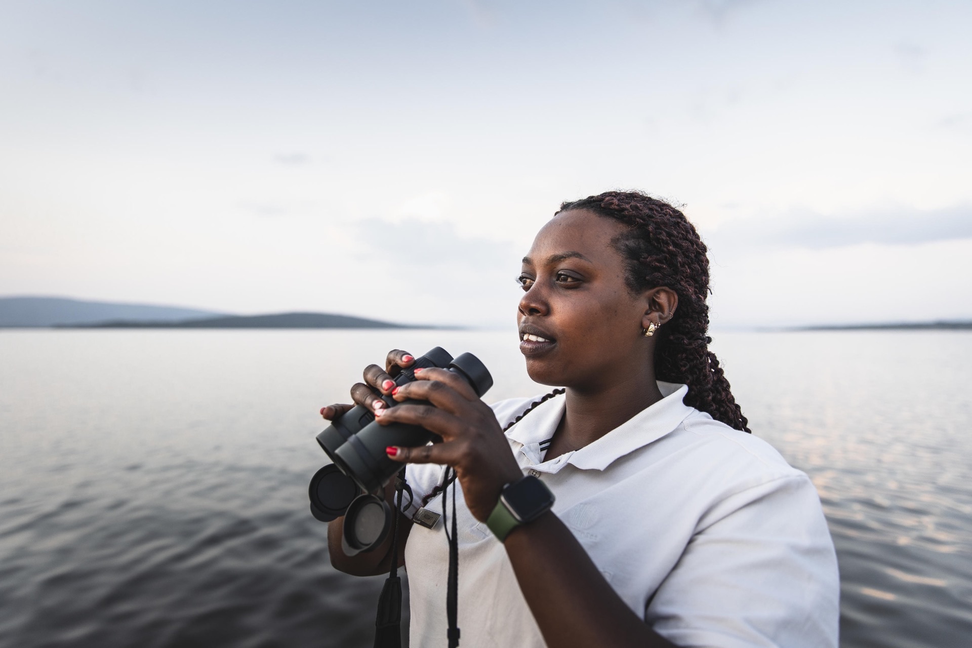 Guide scanning the water at Akagera National Park, Rwanda